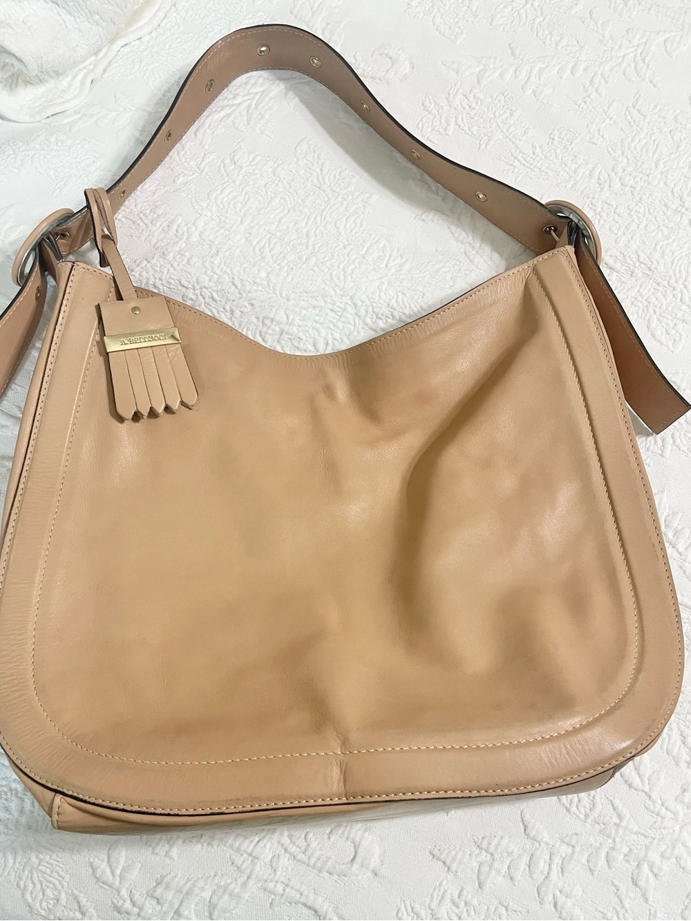 Classic Neutral Leather Hobo Bag with Tassel Accent